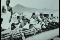 A group of Javan pilgrims is travelling on the top of the bus from Jeddah to Mekkah.  Slow camel 🐪 caravans were replaced with fast-paced, purpose-built buses, avoiding the wildernesses of Saudi Arabia.  Dated: 08-10-1963